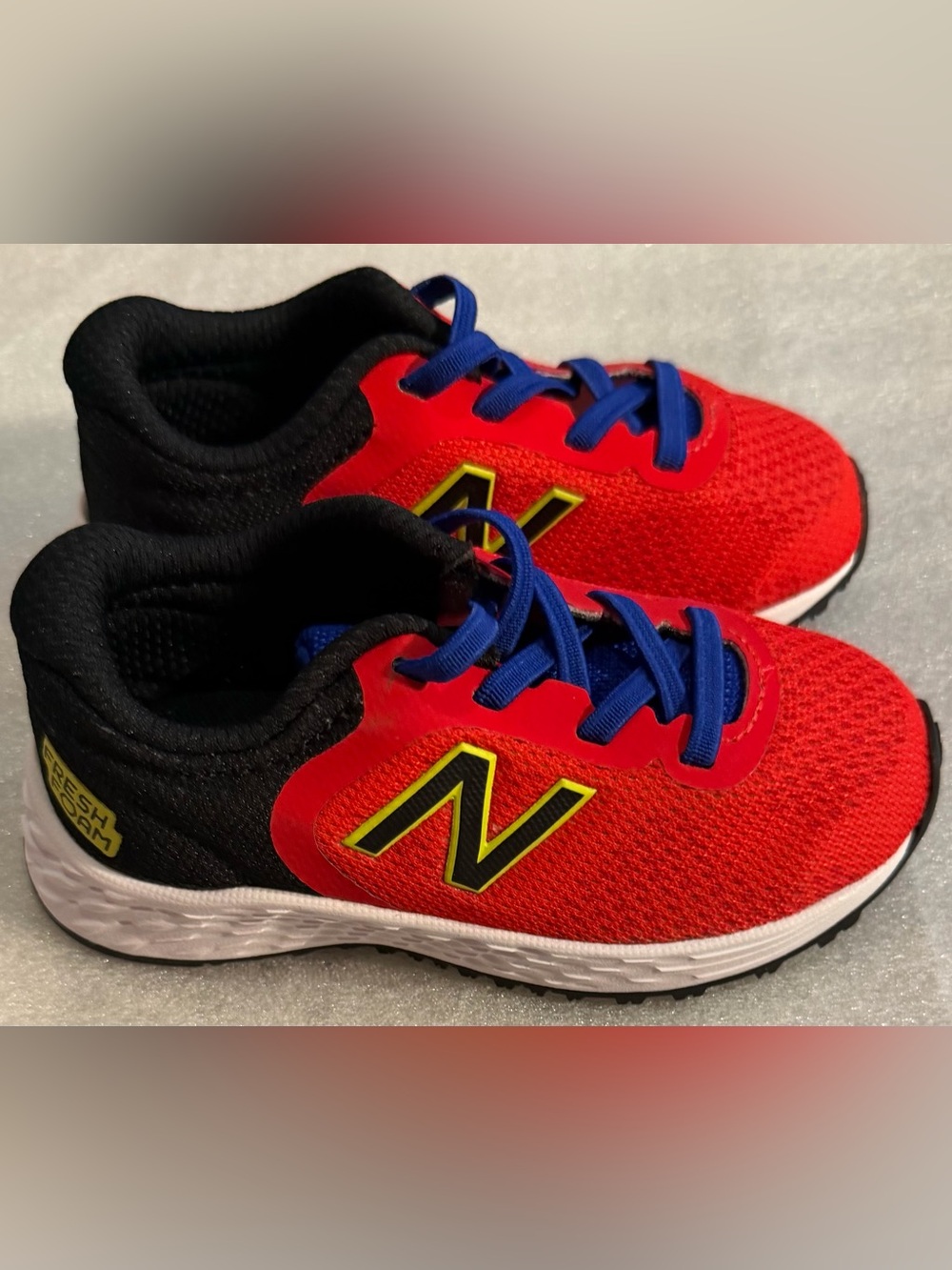 New Balance Red Kids Sneakers with Blue Laces
